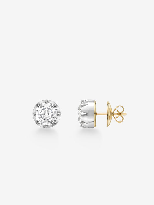 Pair of 3ct diamond stud earrings featuring round brilliant cuts set in white gold with traditional 18K yellow gold posts, showcasing handcrafted antique-inspired design. View 2