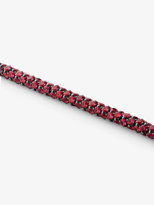 Jessica McCormack ruby bracelet featuring rows of vibrant red rubies set in darkened gold, handcrafted with an antique-inspired contemporary style View 2