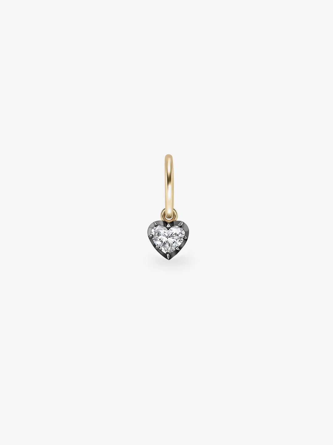 Single hoop earring featuring a heart-shaped diamond set in blackened gold, blending antique-inspired craftsmanship with contemporary design.  View 1