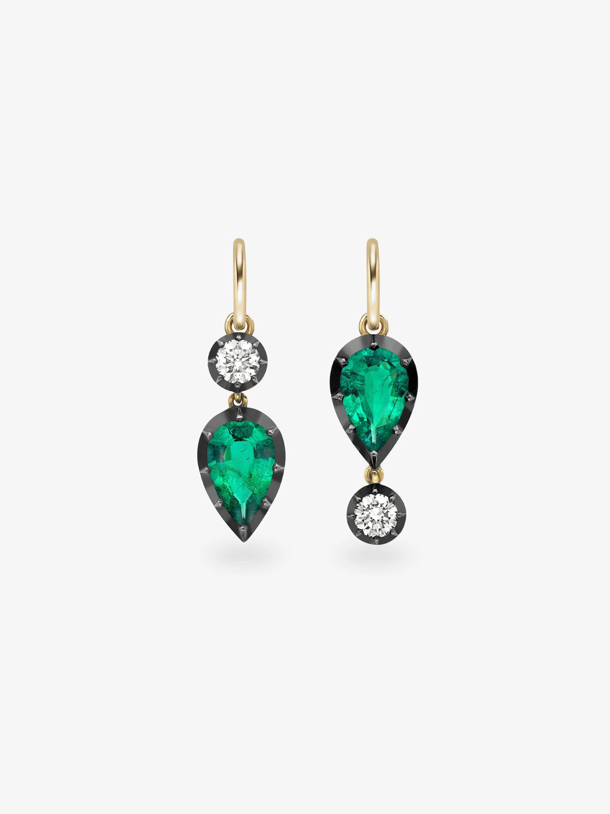 Asymmetric pear shaped emerald and diamond earrings with gold hooks and dark settings showcasing contemporary antique inspired design View 1