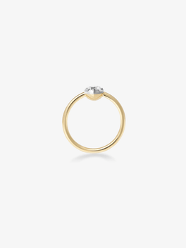 Jessica McCormack ring with a slim gold band, heart shaped diamond in a white gold setting, and button back detail shown from the rear