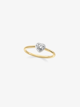 Jessica McCormack ring featuring a heart shaped diamond in a white gold setting on a slender yellow gold band, showcasing contemporary diamond jewellery craftsmanship
