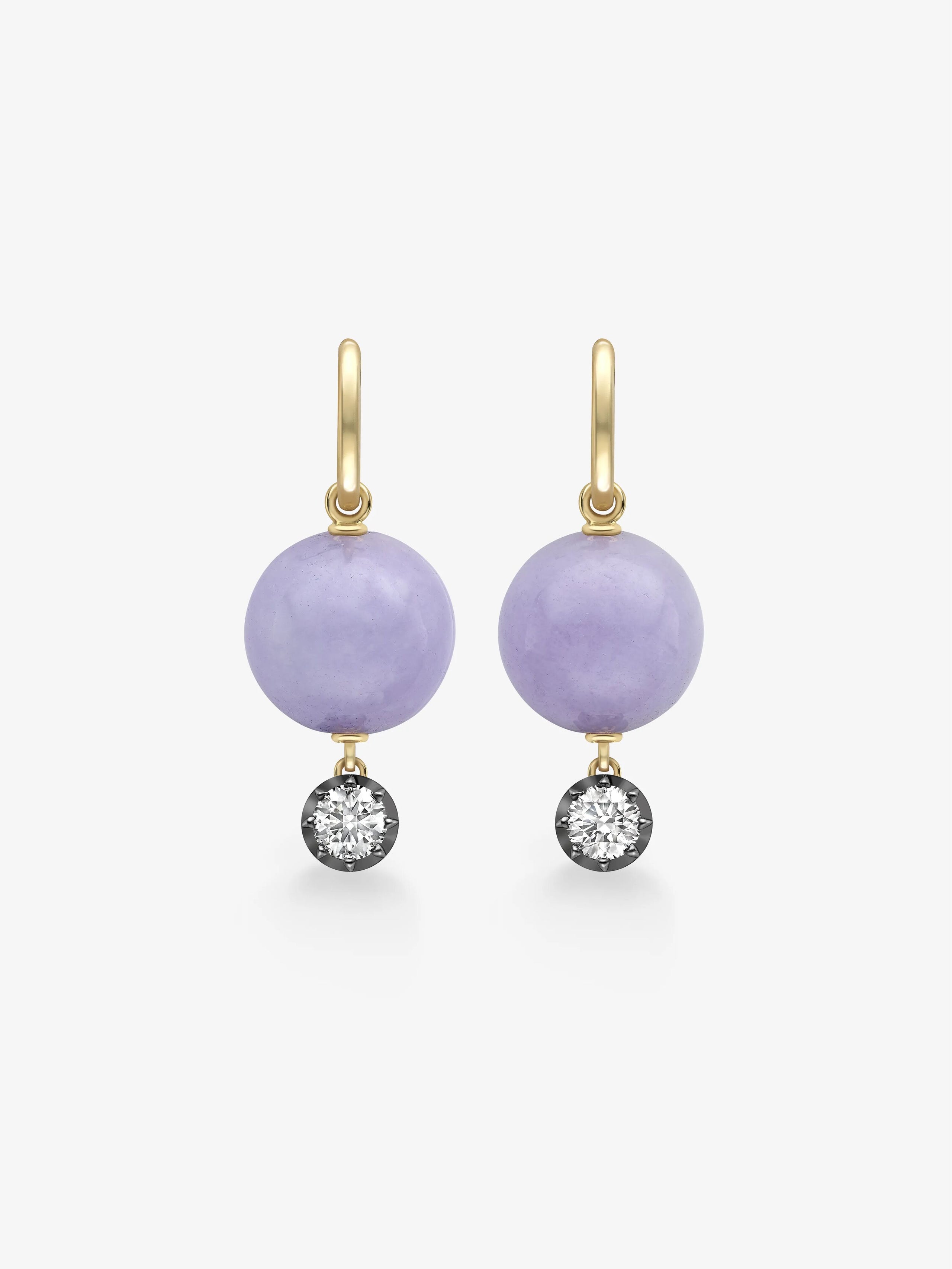 Pair of hoop earrings featuring lilac jade spheres with 0.40ct diamonds set in blackened gold, combining antique-inspired craftsmanship with contemporary elegance. View 1