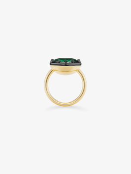 Side view of a 5.81ct heart-shaped emerald ring in yellow gold, featuring a dark button back setting and a slender double-band design