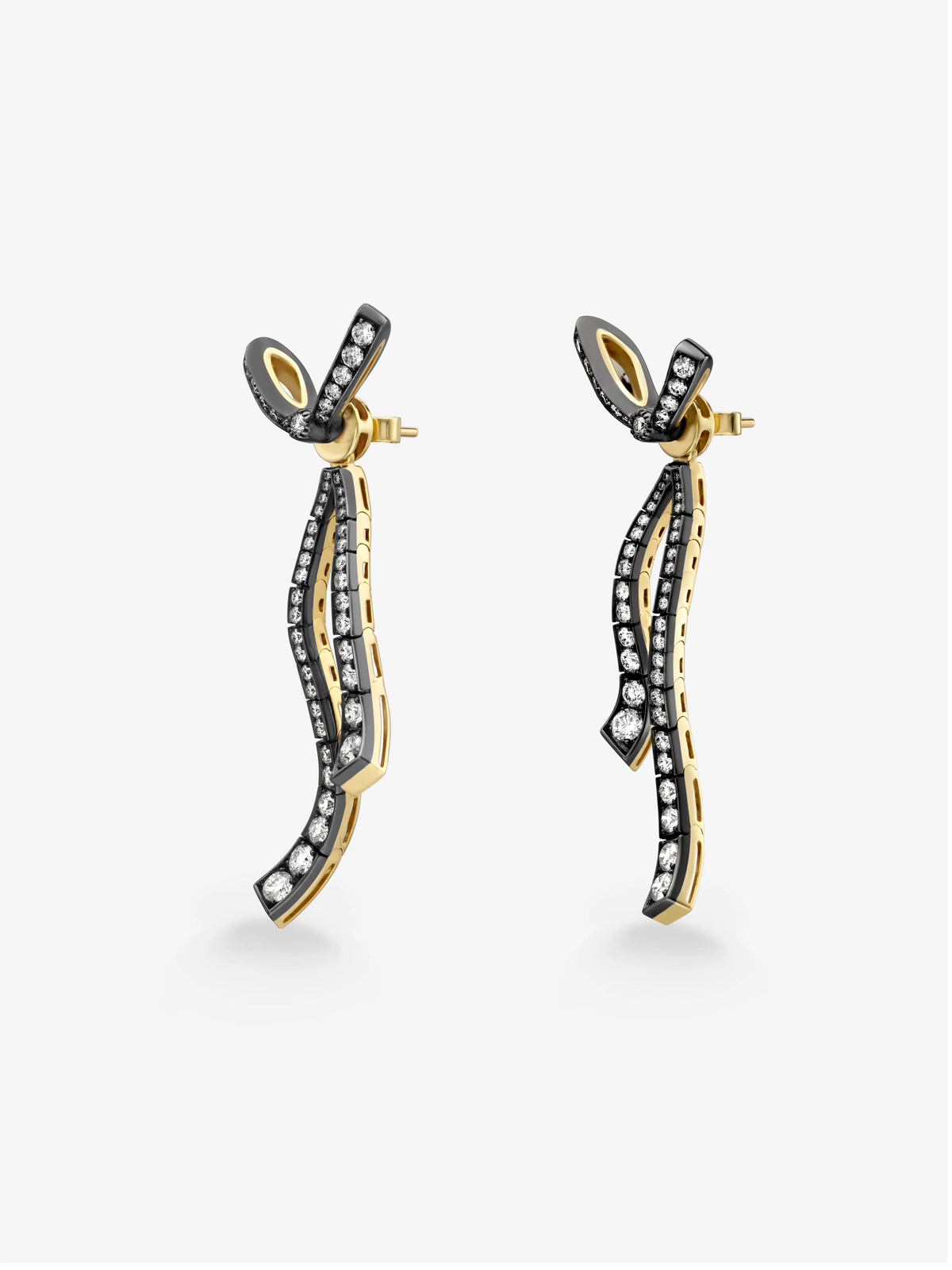 Jessica McCormack diamond ribbon drop earrings in blackened white and yellow gold, featuring curved diamond-set bands and bow-inspired studs. View 4