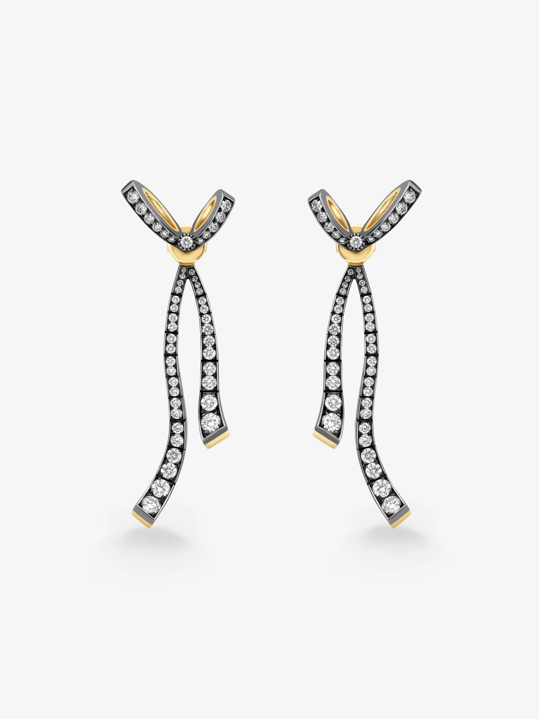Jessica McCormack diamond ribbon drop earrings in blackened gold with curved bow details, diamond set loops and polished yellow gold accents  View 1