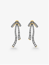 Pair of diamond ribbon drop earrings in blackened gold with yellow gold accents and articulated diamond set loops by Jessica McCormack