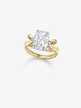 Jessica McCormack ring featuring a 3.03ct cushion cut diamond in a sculptural two tone gold bow setting