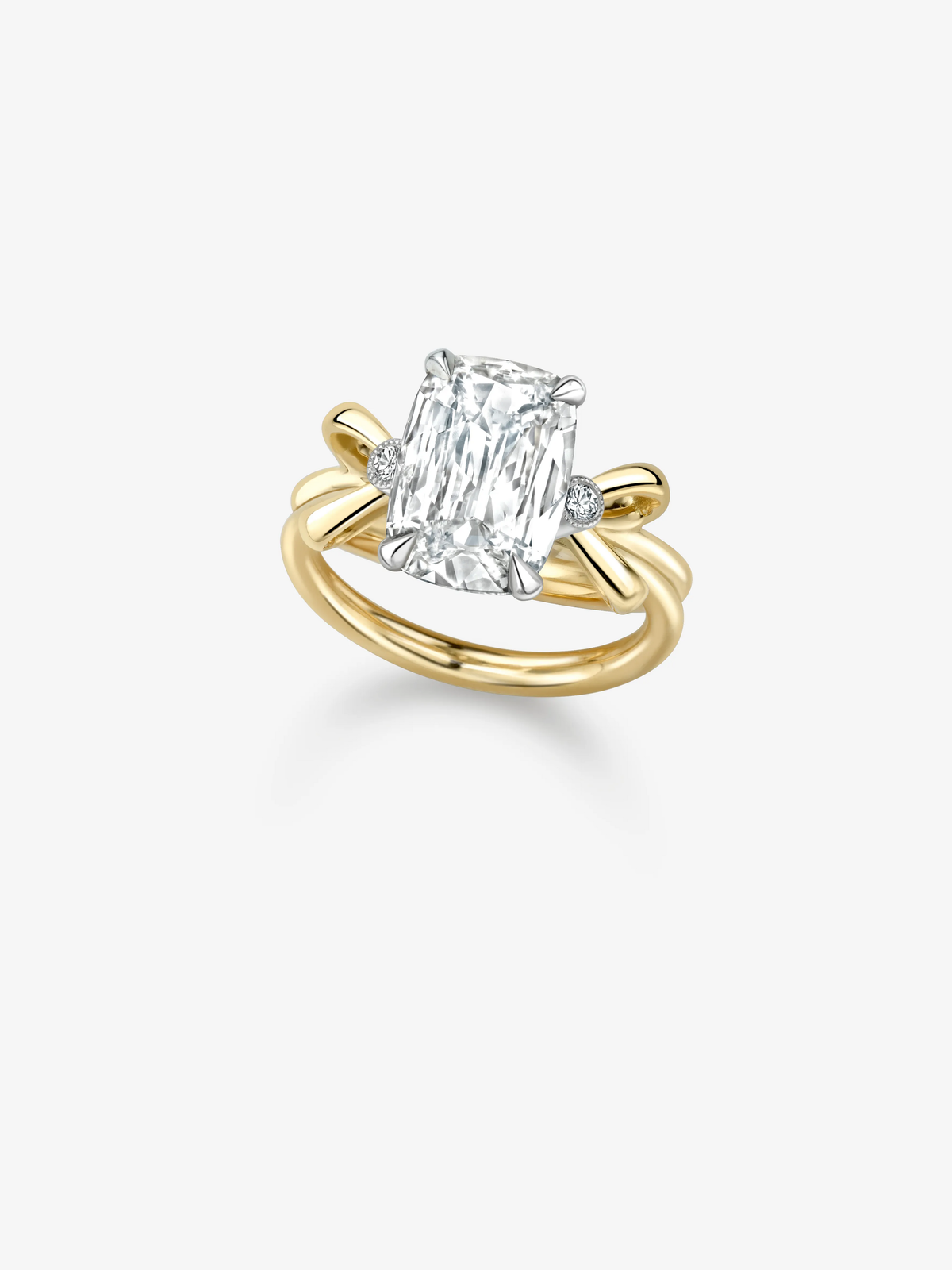 Jessica McCormack ring featuring a 3.03ct cushion cut diamond in a sculptural two tone gold bow setting View 2
