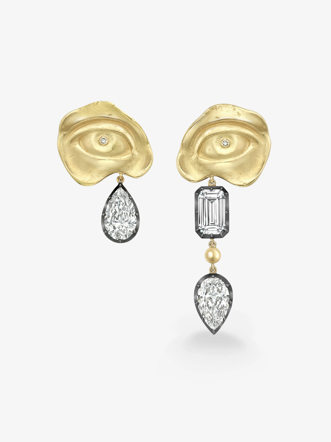 Asymmetrical earrings featuring hand-shaped 18K yellow gold tops with small diamonds and contrasting pear-shaped and emerald-cut diamonds set in blackened white gold.  View 1
