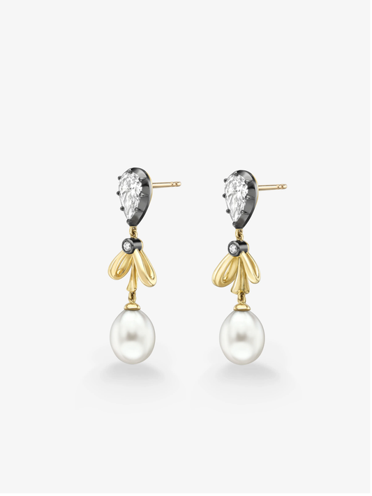 Diamond and gold bow earrings with sculptural loops, oval diamonds and large white pearl drops on a white background View 2