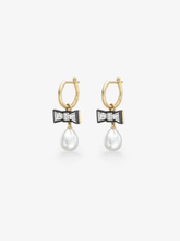 Jessica McCormack diamond and pearl gypset hoop earrings with gold hoops, blackened bow details and white pearl drops