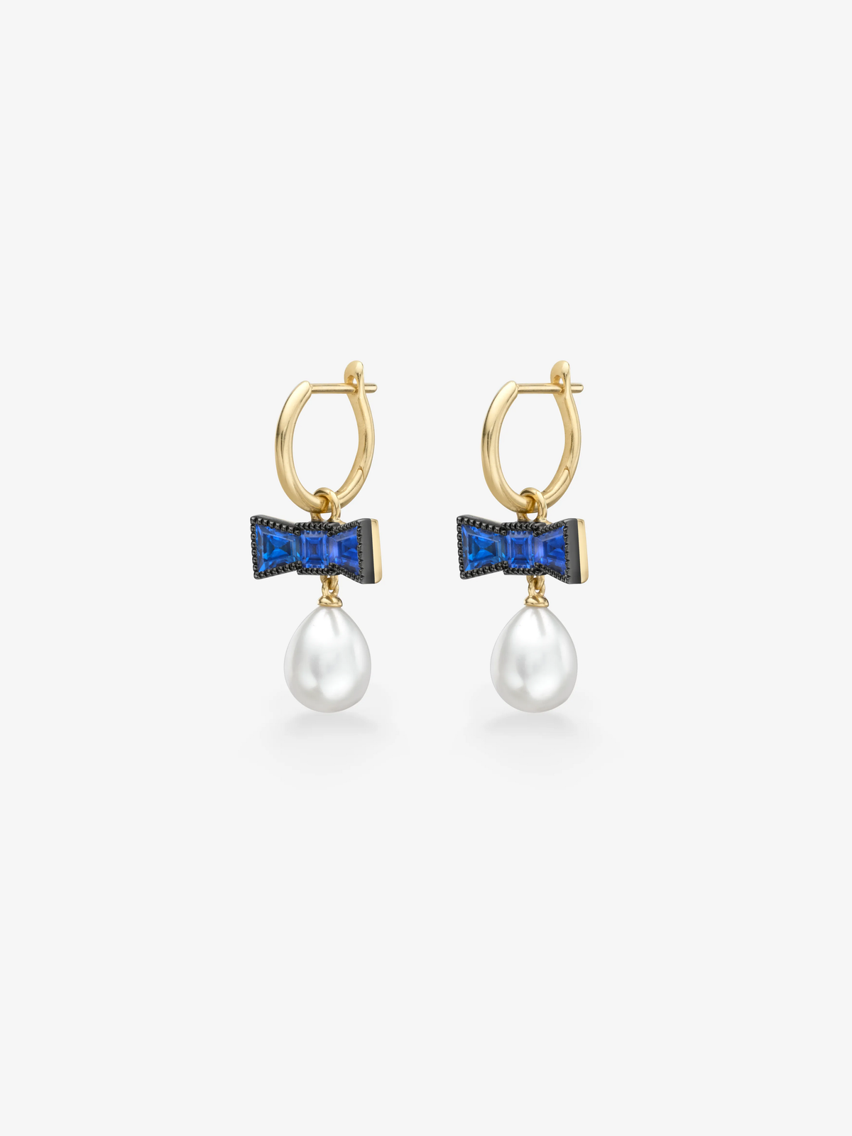 Pair of gold hoop earrings with blue sapphire bow motifs and lustrous white pearl drops, showcasing playful contemporary jewellery design View 2