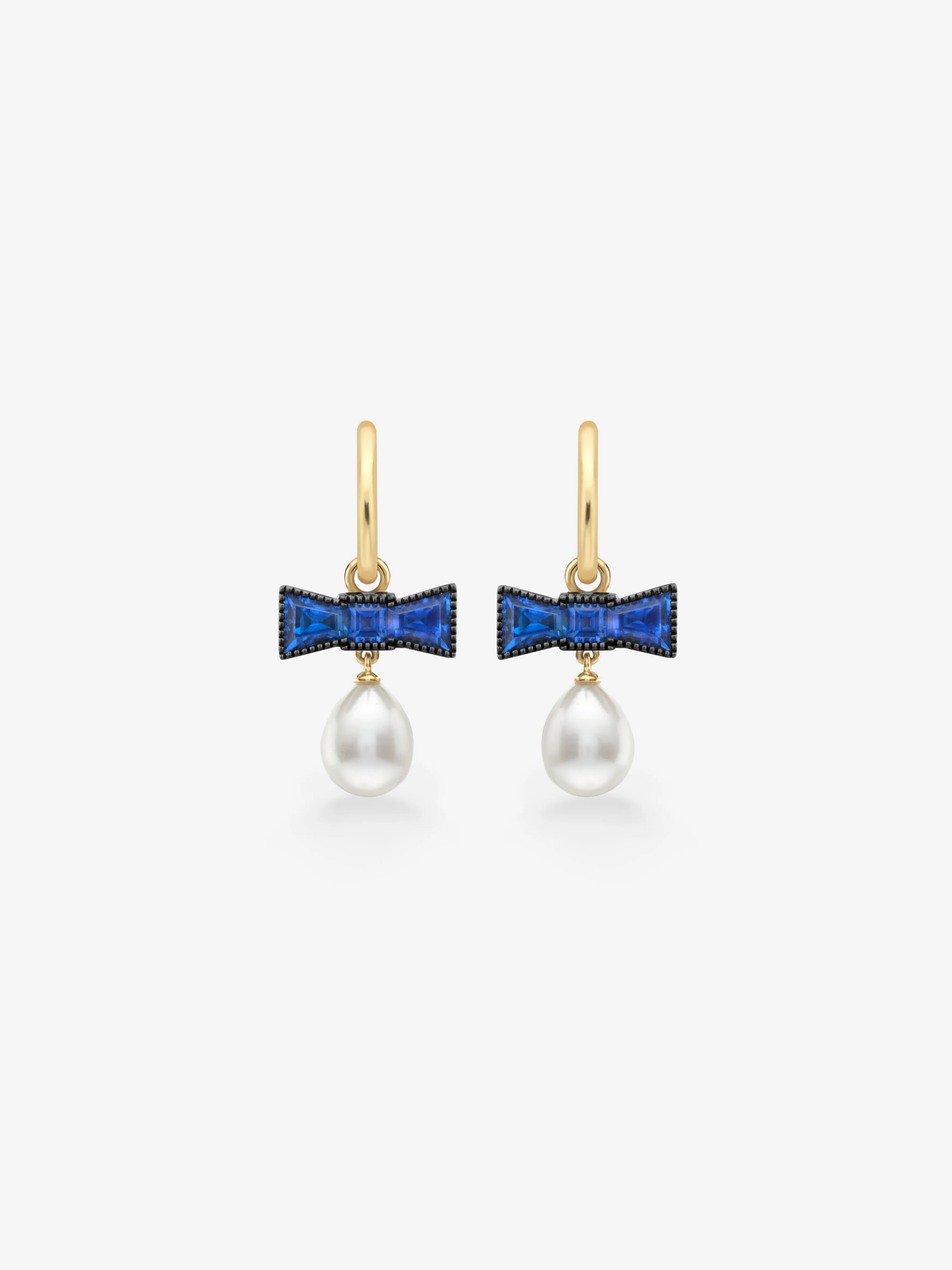 Jessica McCormack sapphire and pearl hoop earrings with blue bow shaped settings and lustrous white pearl drops in gold View 1