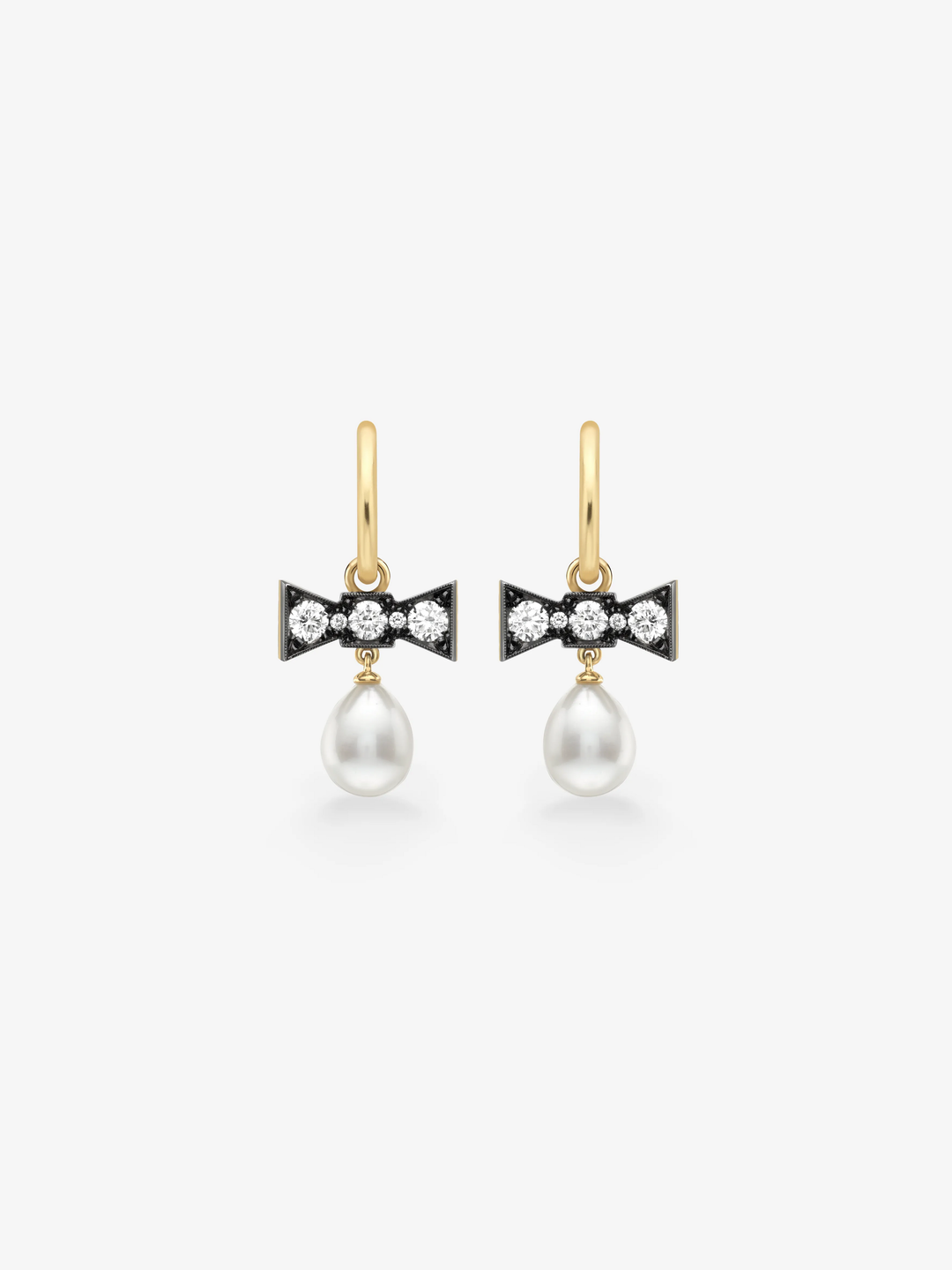Yellow gold hoop earrings with diamond-set bow motifs and dangling white pearls, combining contemporary style with a playful gypset aesthetic.  View 1