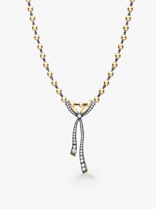 Diamond ribbon pendant necklace with a sculptural bow design, pavé diamond detailing, and a beaded two tone chain in gold and blackened metal View 2