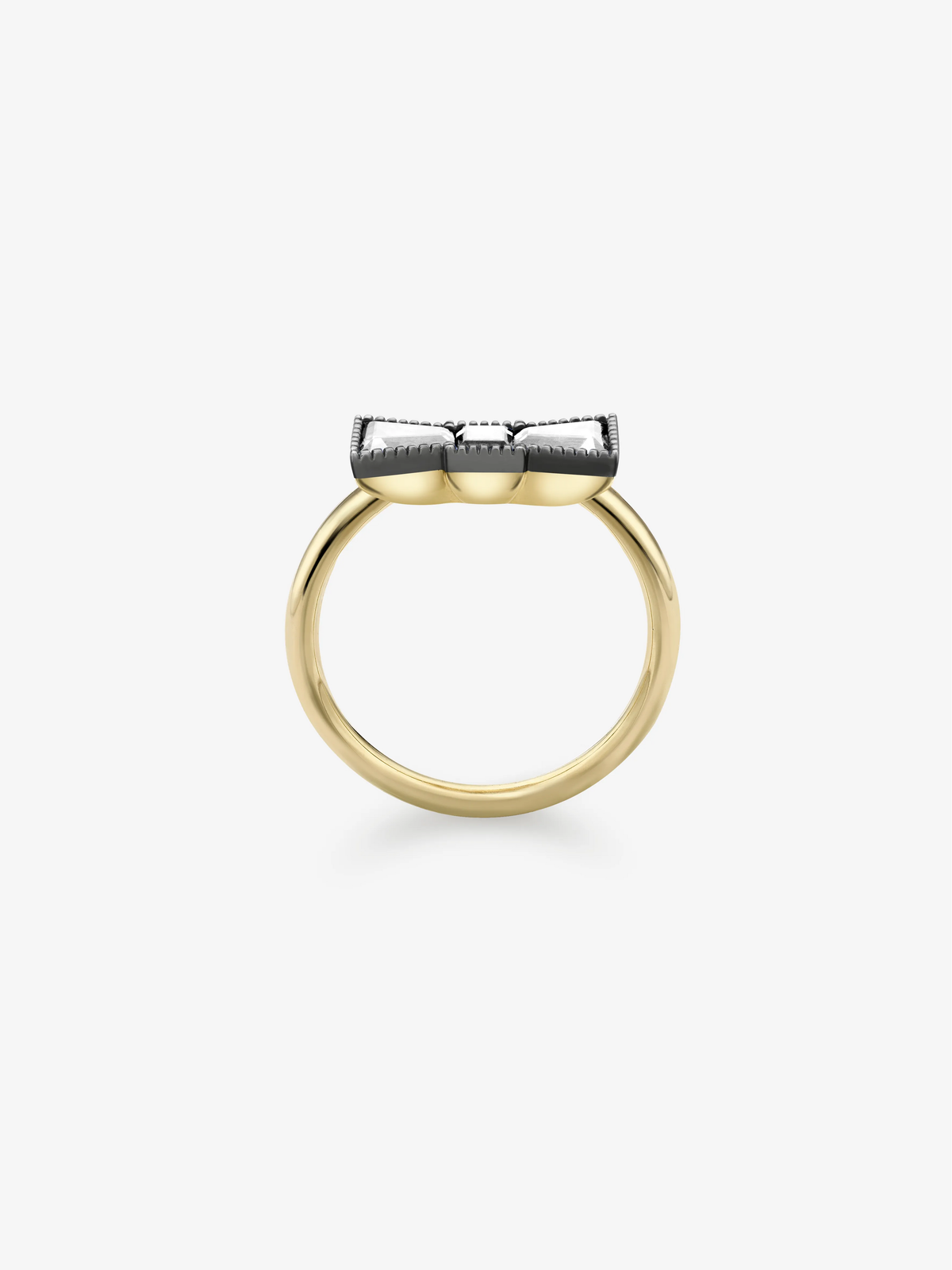 Side view of a diamond ring with a polished yellow gold band and raised blackened white gold bow-inspired setting, showcasing refined contemporary craftsmanship View 4