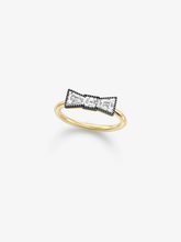 Diamond bow ring with a polished yellow gold band and contrasting blackened white gold bow set with round diamonds