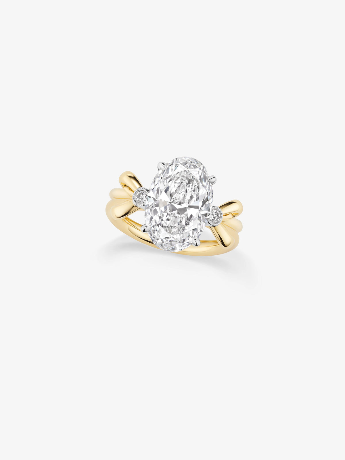 Jessica McCormack oval diamond ring with a large central oval stone, diamond accents and sculptural yellow gold bow details View 2