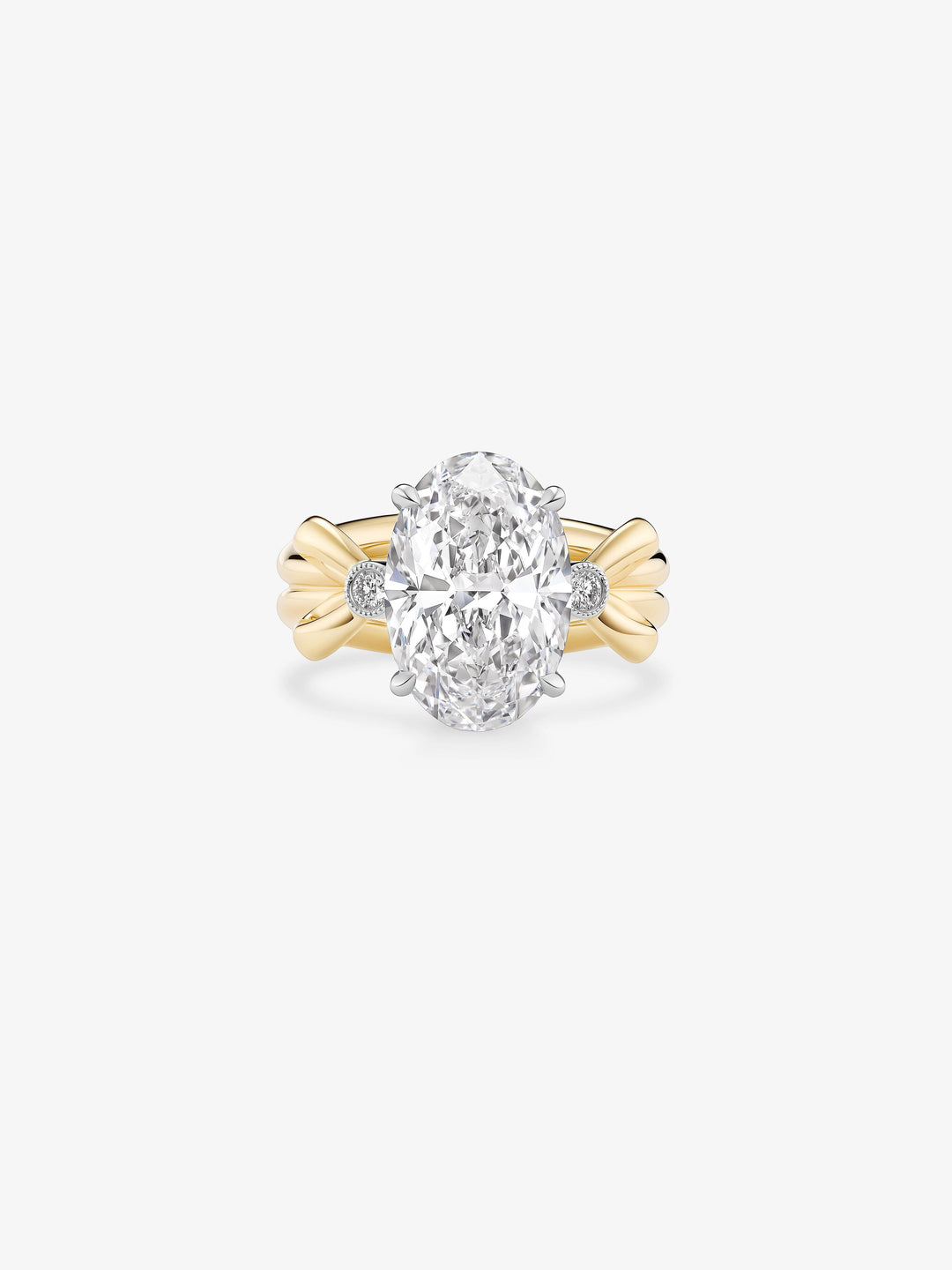 Jessica McCormack oval diamond ring with a large oval cut centre diamond, round side diamonds and sculptural yellow gold bow motifs  View 1