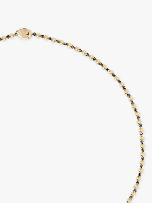 Delicate yellow gold micro ball and chain necklace featuring hand-finished links with antique-inspired contrast detailing and a secure clasp. View 4