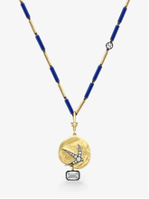 Gold necklace with blue beads and a decorative pendant on a white background