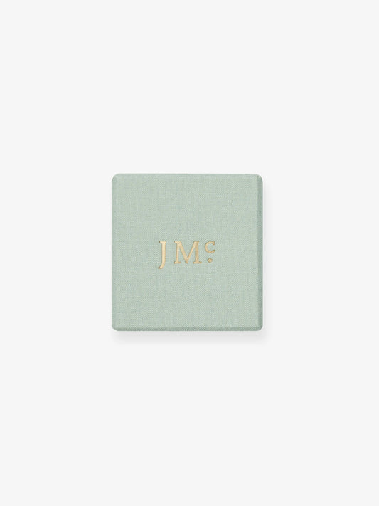 Pale green Jessica McCormack jewellery box with gold JM initials on the lid View 4