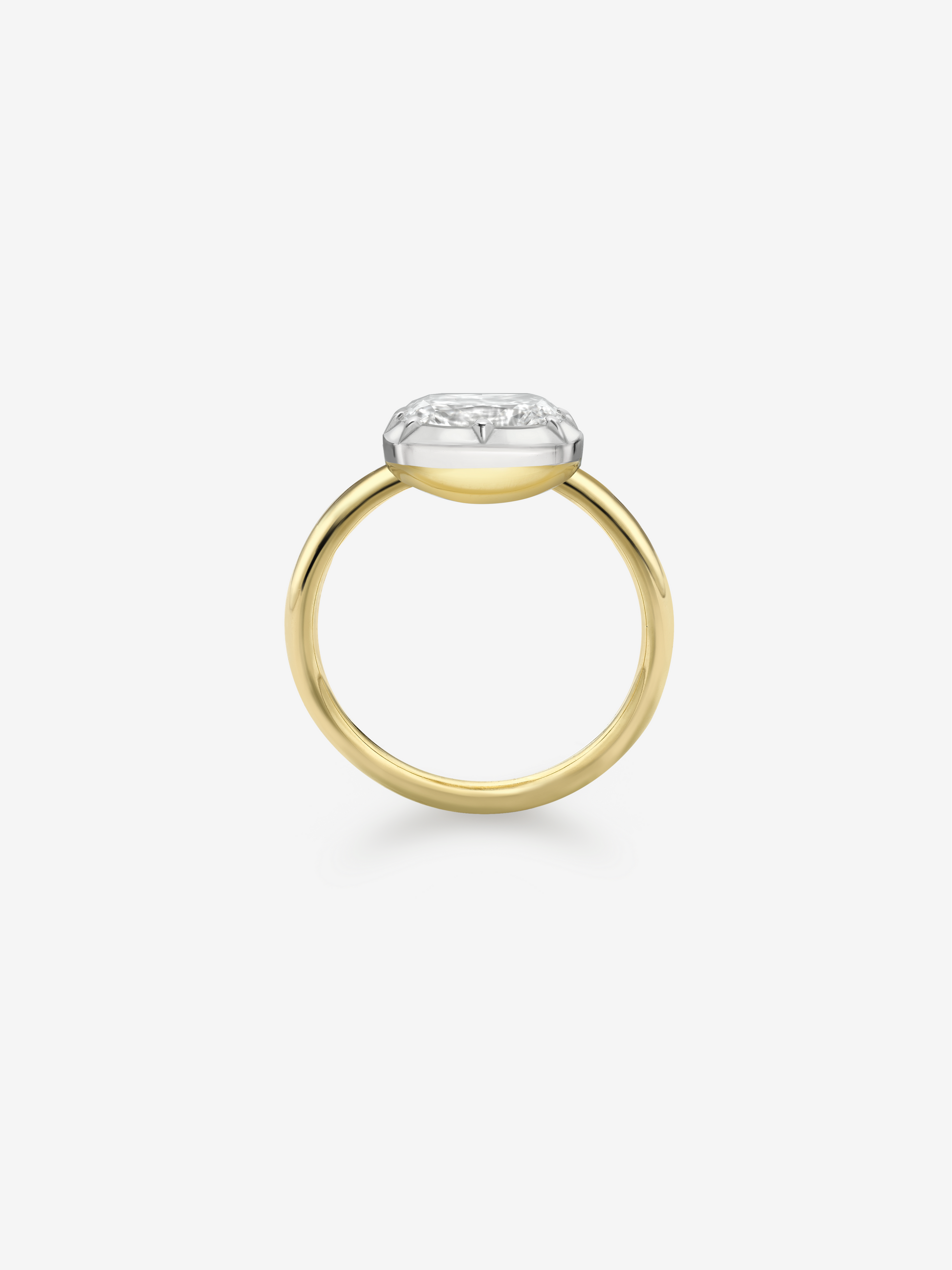 Minimalist 18K yellow gold ring featuring a cushion-cut diamond set east-west in a button back setting, blending antique inspiration with contemporary craftsmanship. View 4