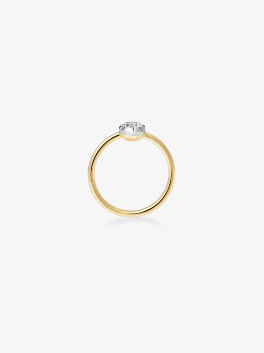 Delicate 0.50ct diamond set in a minimalist, hand-crafted yellow and white gold button back ring, blending antique inspiration with contemporary design. View 4